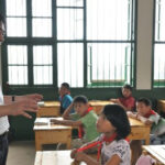 王振华, 猥亵女童的董事长：自称农民儿子 曾是江苏的骄傲 – 其情妇周某芬经常帮助他物色女童