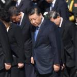 人民日报头版再次黑习近平